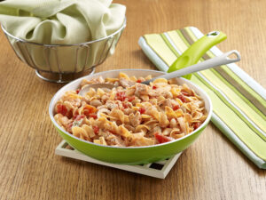 Egg noodles with fresh salmon, tomatoes, white beans, and white wine sauce