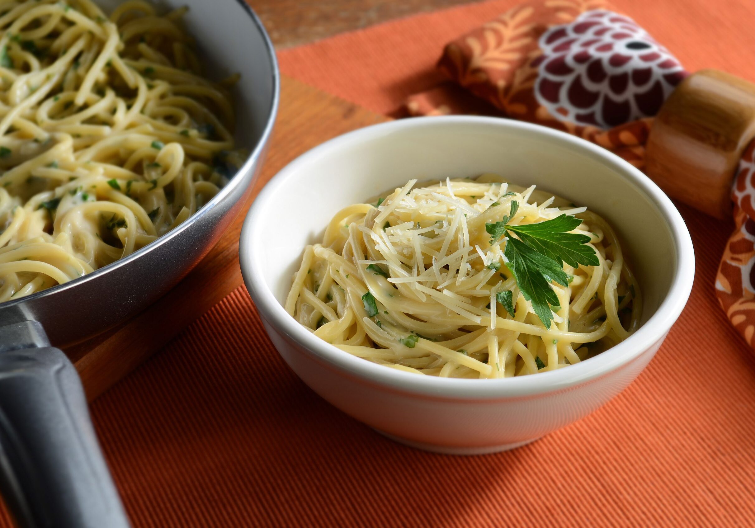 Herb linguine with Alfredo sauce, basil, and fresh parsley, topped with Parmesan