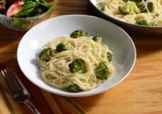Angel hair and broccoli in a light sauce, topped with Parmesan